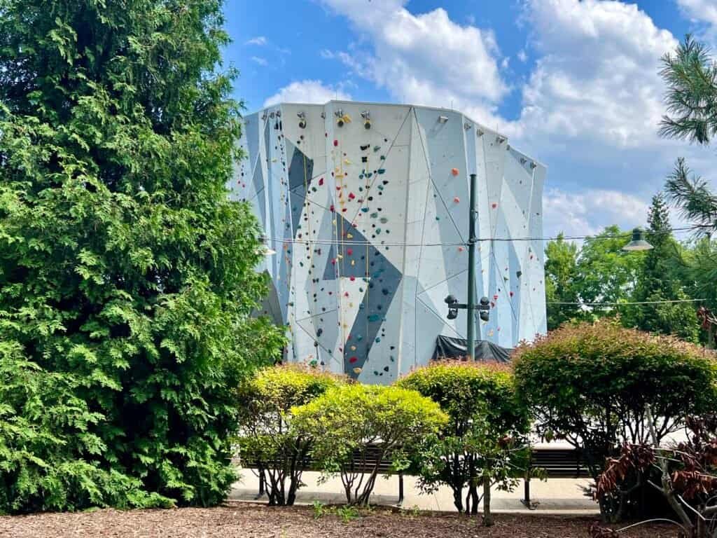 Outdoor climbing walls rising above Maggie Daley Park in downtown Chicago