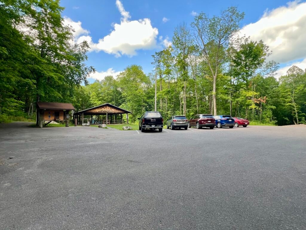 Summit parking lot at Timms Hill County Park with pavilion and trail access in Wisconsin.