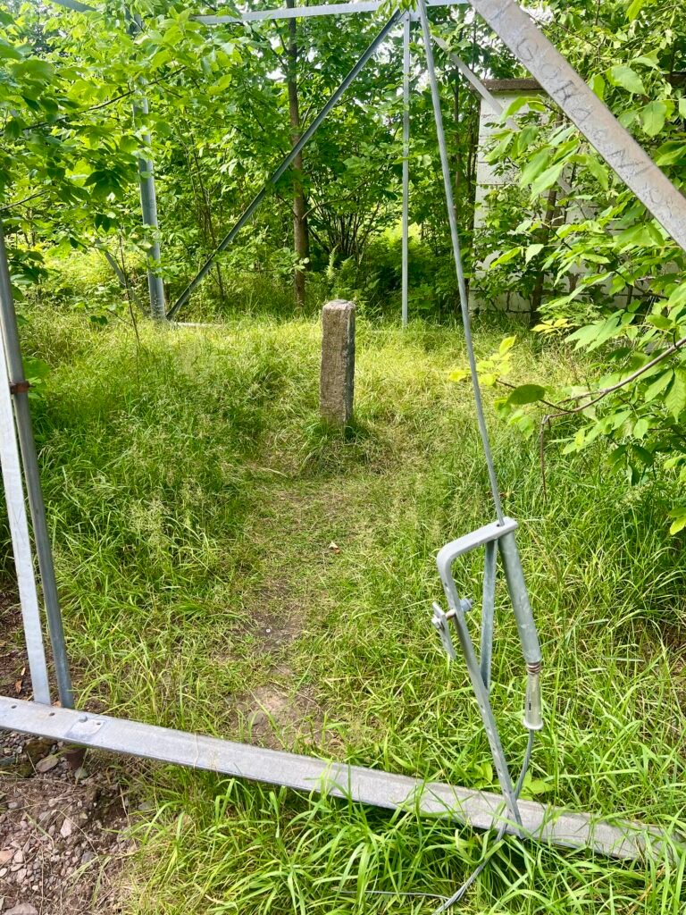 Concrete survey monument with U.S. Geological Survey benchmark at Timms Hill summit in Wisconsin.