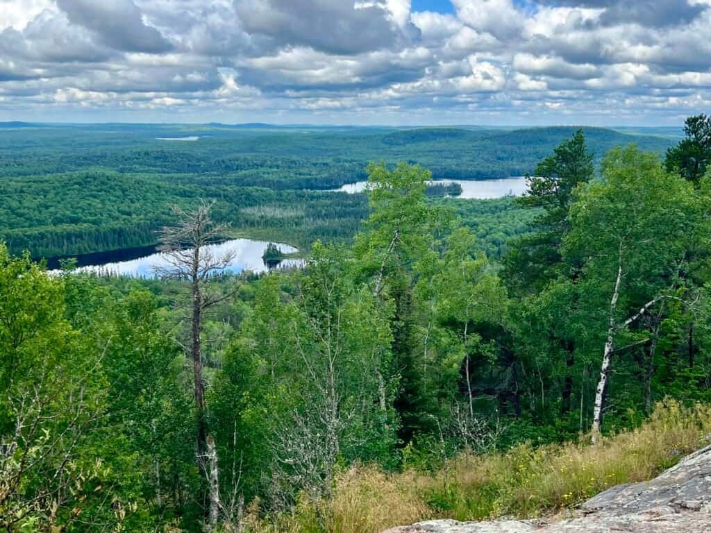 View from Eagle Mountain showing Shrike Lake in the foreground and Zoo Lake beyond, surrounded by dense forest