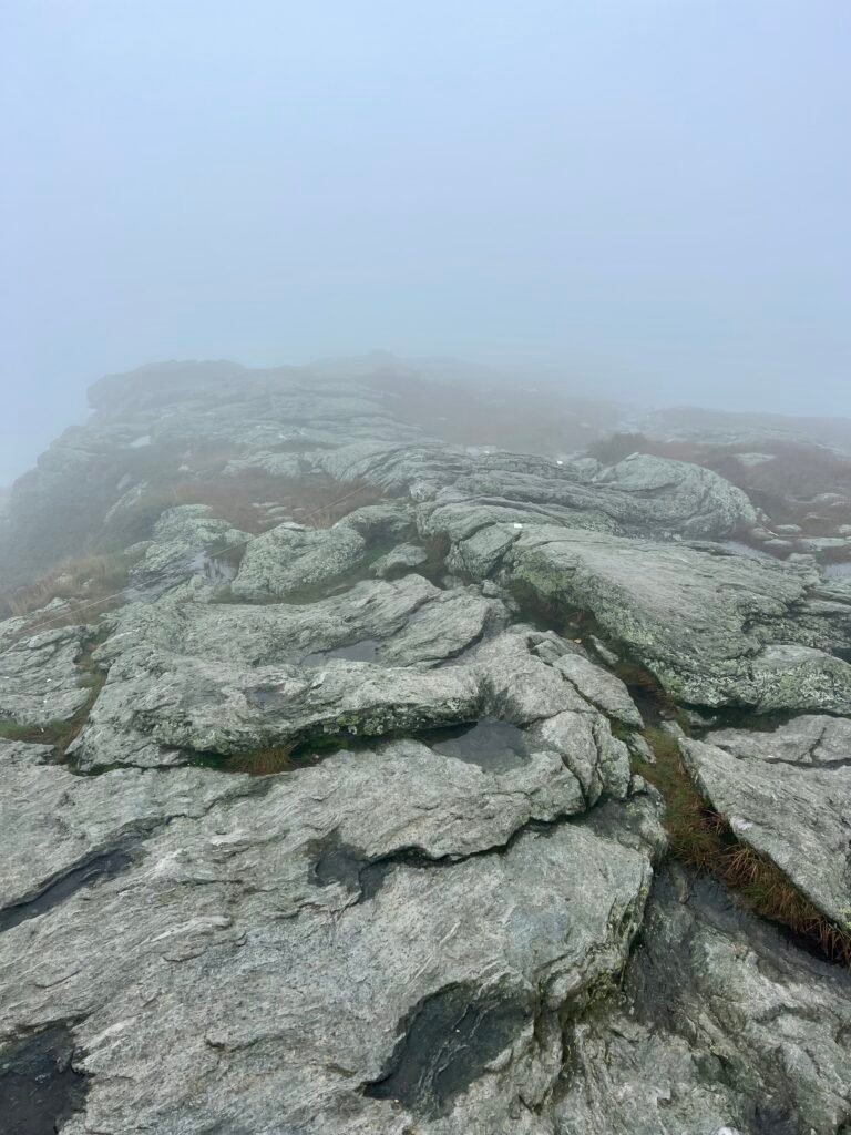 Foggy, barren granite ridge near the Mount Mansfield summit resembling an Icelandic landscape.