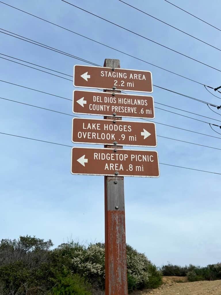 Trail marker sign along the Ridgeline Maintenance Road in Elfin Forest Recreational Reserve