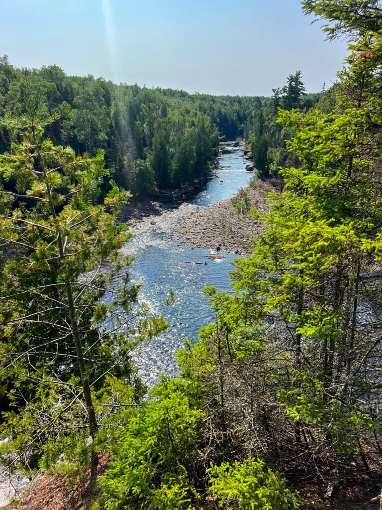 Elevated view of the Baptism River winding through forest in Tettegouche State Park, Minnesota.