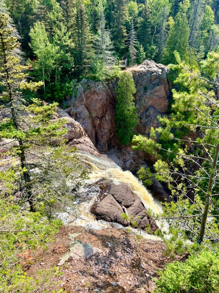 High Falls cascading into rocky gorge along the Baptism River in Tettegouche State Park, Minnesota.