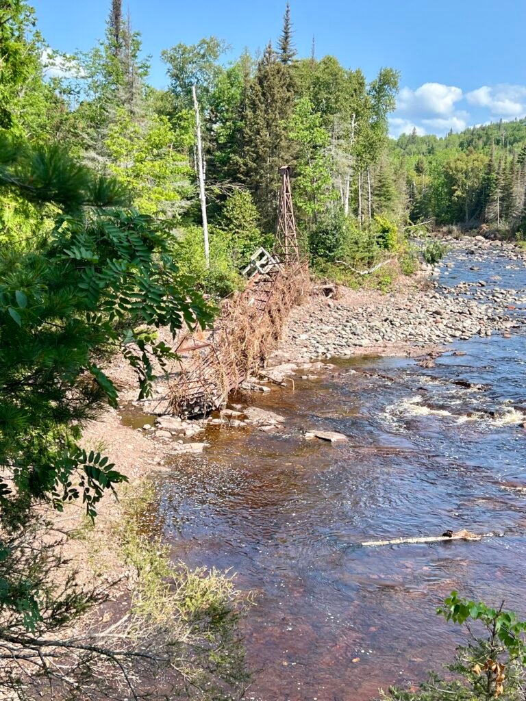 Remnants of twisted swinging bridge along the Baptism River in Tettegouche State Park.
