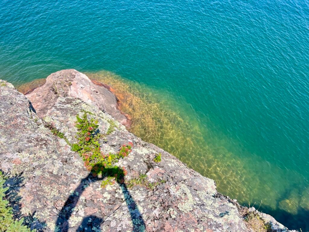 Turquoise waters of Lake Superior viewed from a rocky cliff along Minnesota’s North Shore.